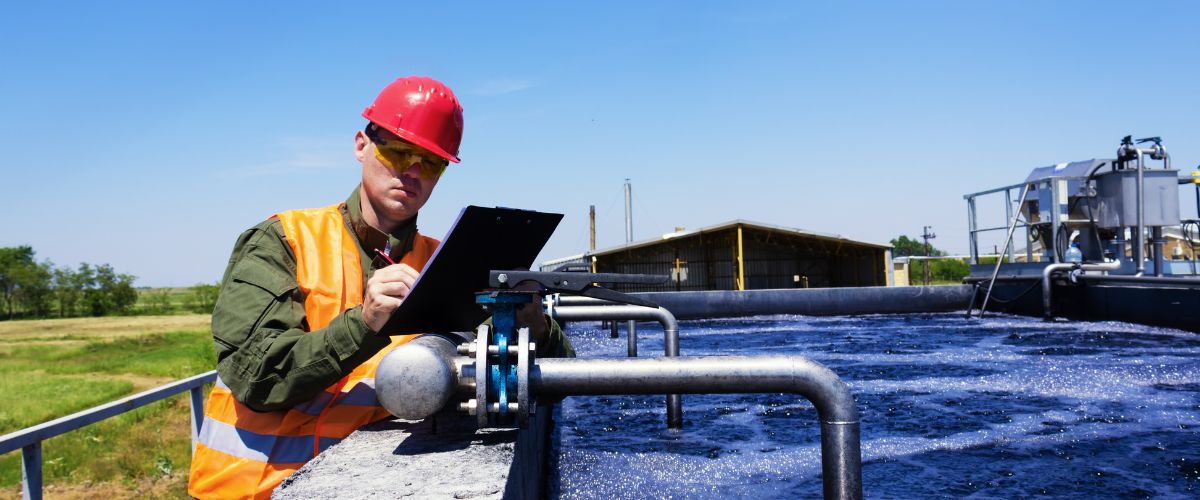 a city worker inspecting water systems